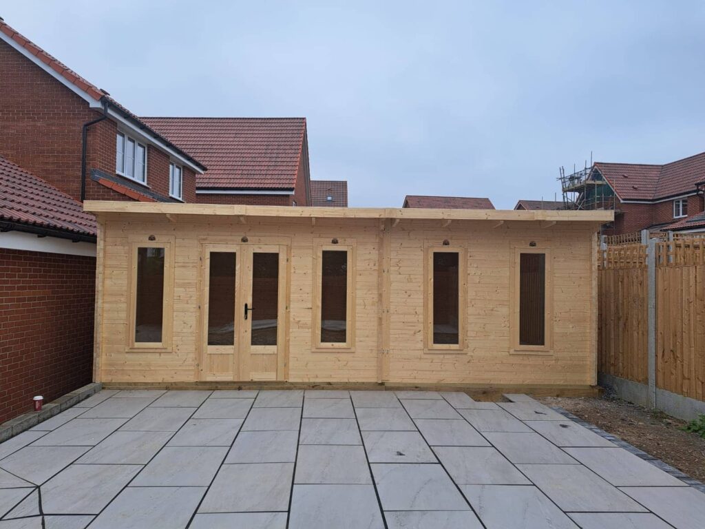 Finished garden shed with an unpainted natural wood look.